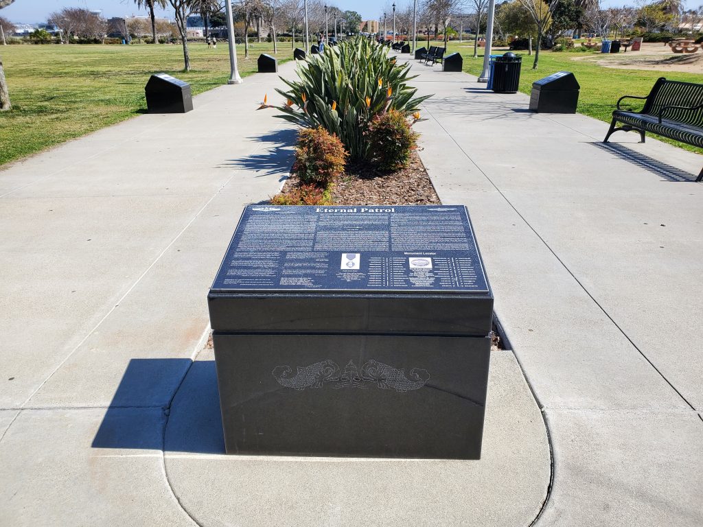 Photo showing the "entrance" and introduction plaque for the 52 Boats Memorial at Liberty Station in San Diego