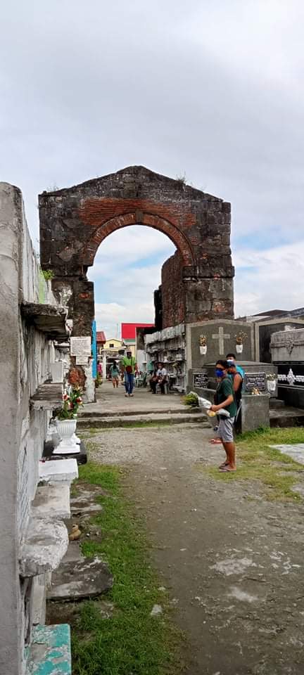 Inside the cemetery, looking toward the main entrance, "apartment tombs" are visible near and in what is left of the brick church structure
Saint Peter Catholic Cemetery in Cavite City