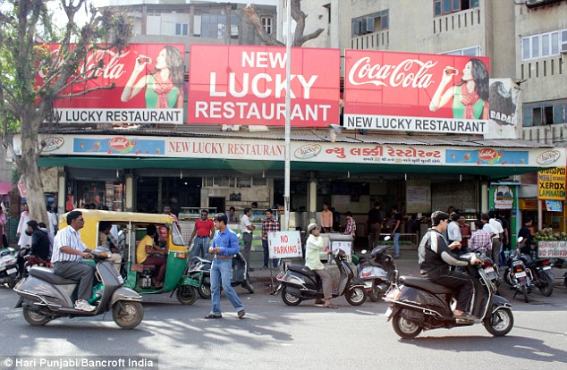photo of the front of the New Lucky Restaurant in India, from i.dailymail.co.uk
Eat Among the Graves in this Restaurant in India