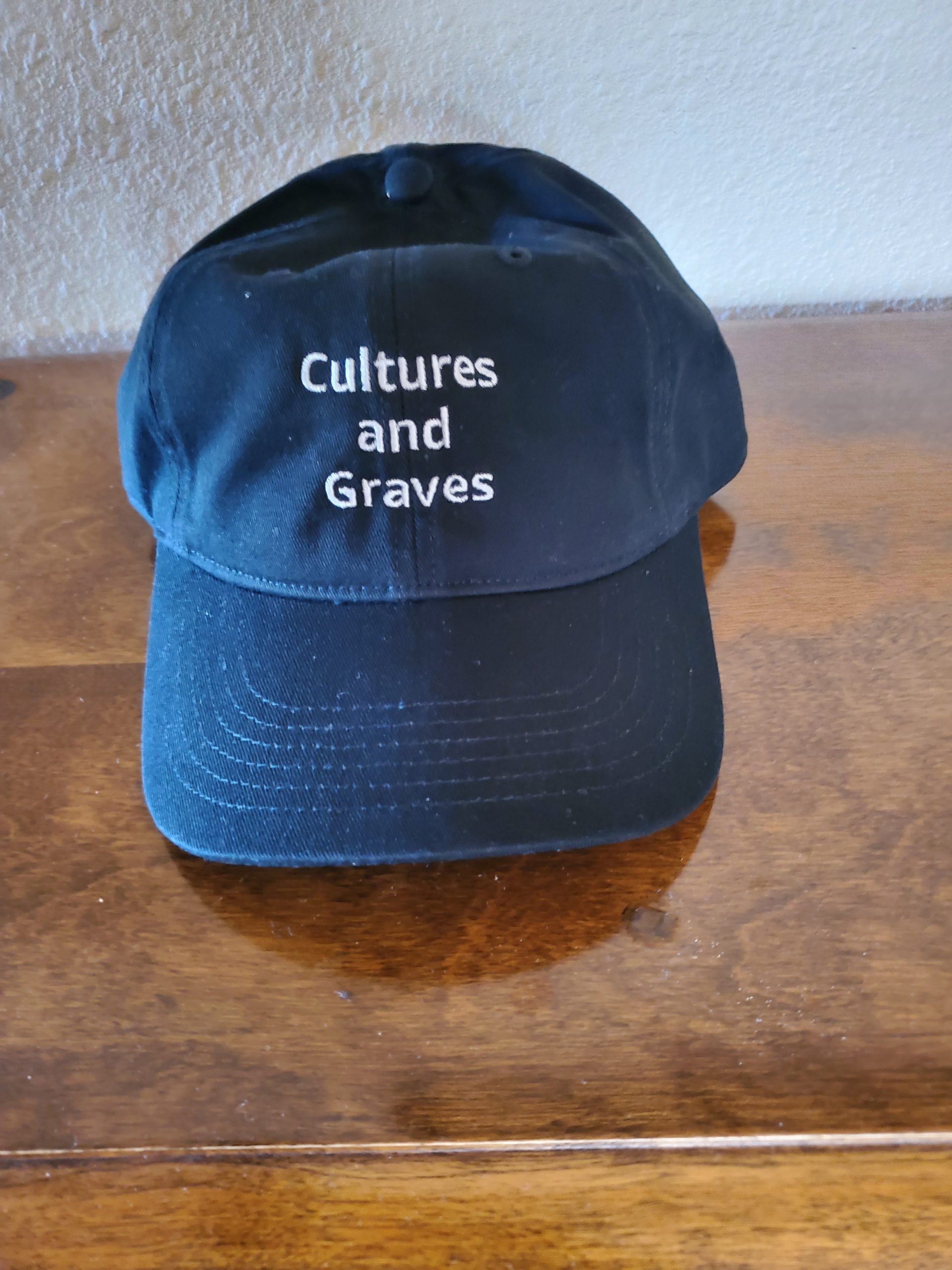 Front of Cultures and Graves hat