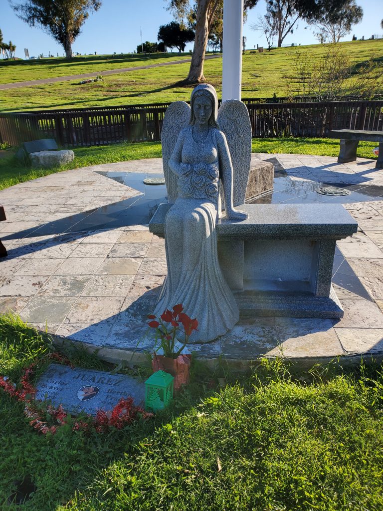 angel statue in the flag plaza, visiting La Vista Memorial Park